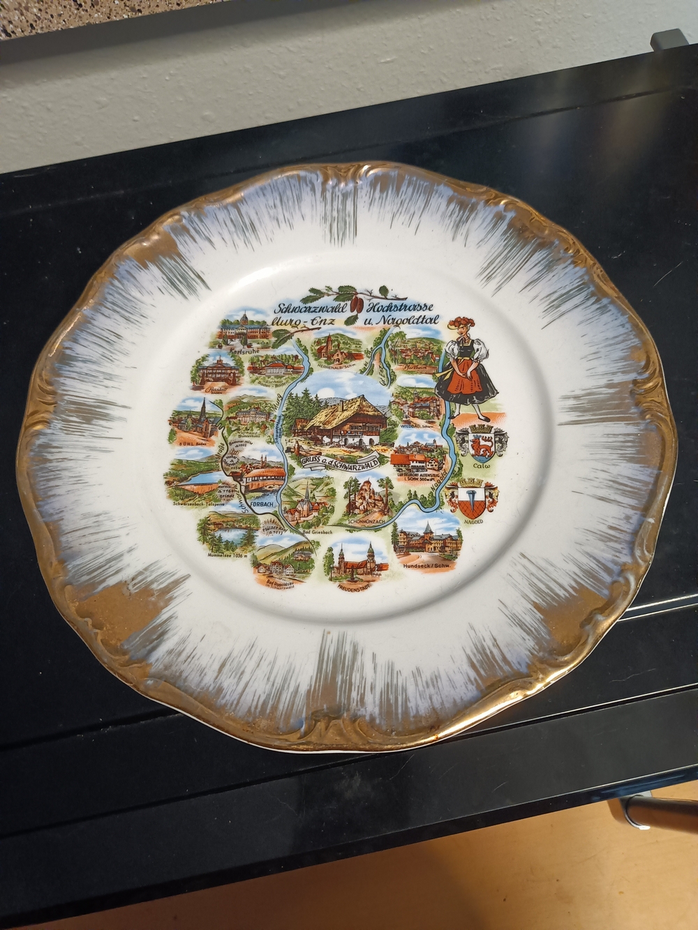 Decorative White and Gold Souvenir Plate with Scenic Black Forest Motif
